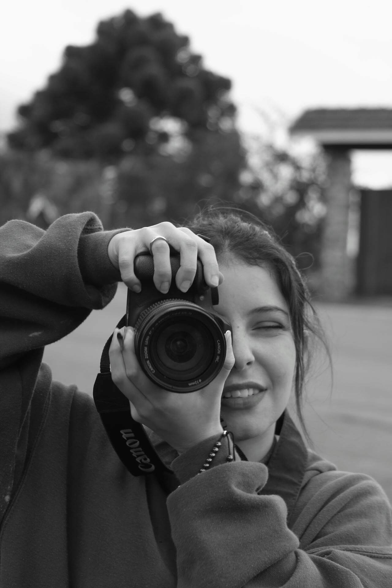 An image of a woman with her professional camera